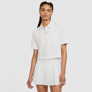 Nike white cri-fit polo shirt with tag.